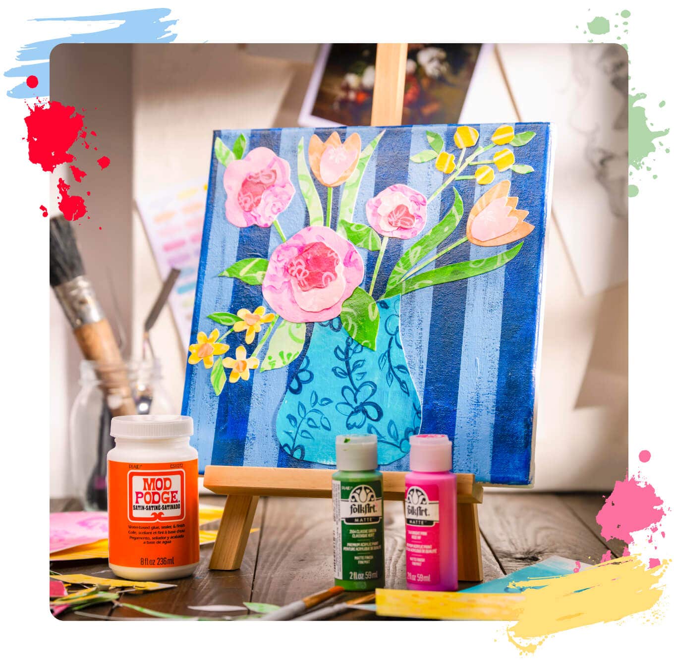 Paper collage flowers on a blue striped canvas